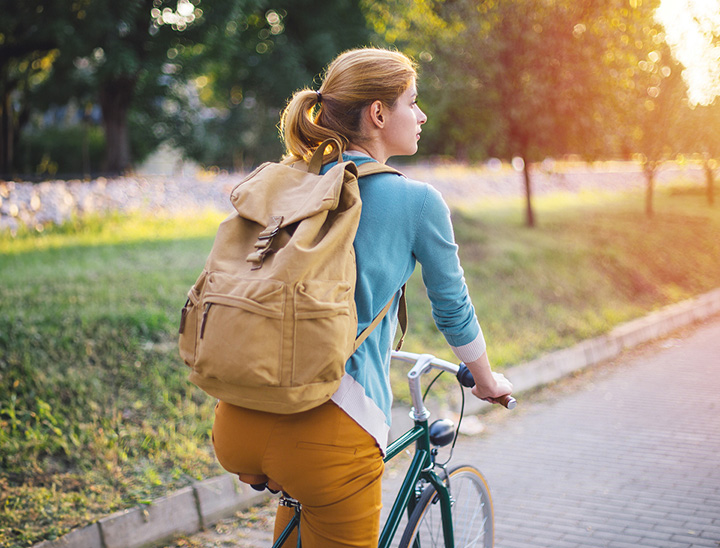 Image of person cycling to work on their bicycle.